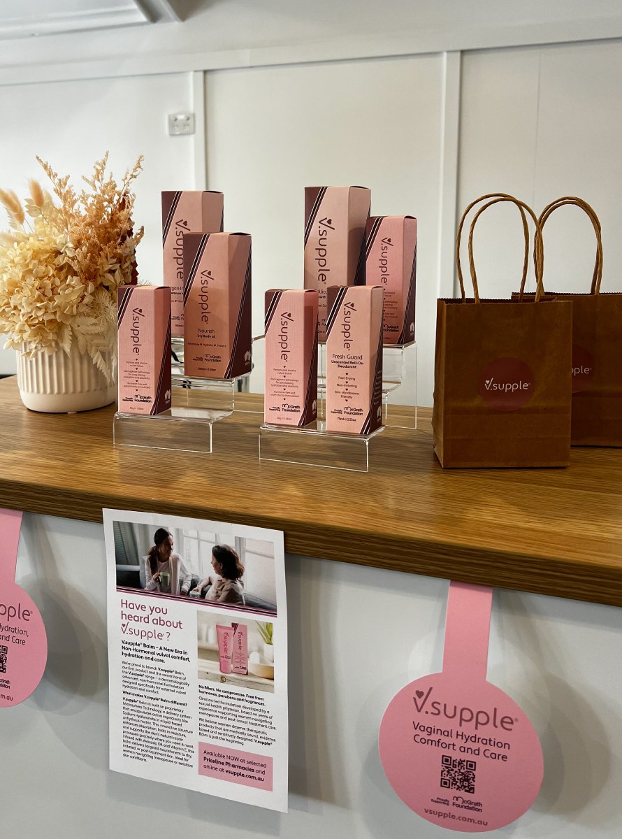 V.supple boxes and bags on the reception shelf, with dried flowers.